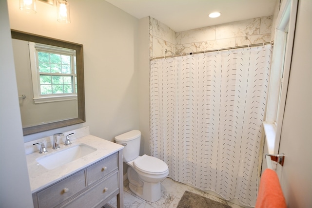 bathroom featuring tile patterned floors, toilet, and vanity