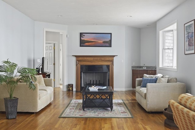 267 Barnes Rd, Oak Bluffs, MA 02557 - living area with a fireplace with flush hearth, baseboards, and wood finished floors