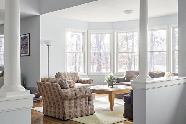 267 Barnes Rd, Oak Bluffs, MA 02557 - living room featuring dark wood-style flooring and ornate columns