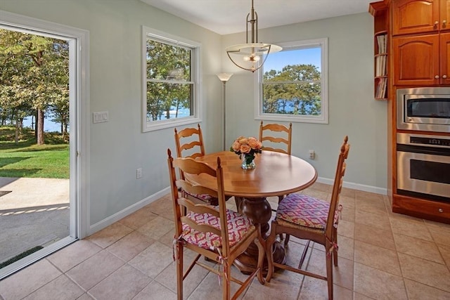 267 Barnes Rd, Oak Bluffs, MA 02557 - dining room featuring light tile patterned flooring and baseboards