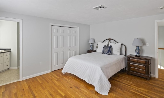 267 Barnes Rd, Oak Bluffs, MA 02557 - bedroom featuring a closet, baseboards, and light wood-style flooring