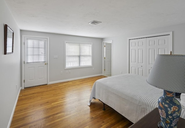 267 Barnes Rd, Oak Bluffs, MA 02557 - bedroom featuring baseboards, visible vents, a closet, and light wood-type flooring