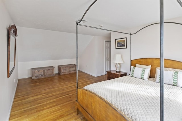 267 Barnes Rd, Oak Bluffs, MA 02557 - bedroom with baseboards, lofted ceiling, visible vents, and wood finished floors