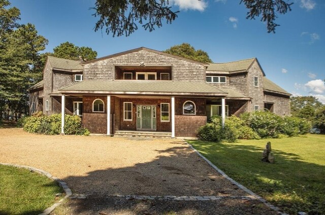 267 Barnes Rd, Oak Bluffs, MA 02557 - shingle-style home with a porch and a front lawn