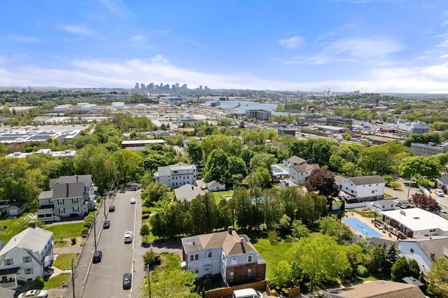 view of urban area featuring a tree filled landscape