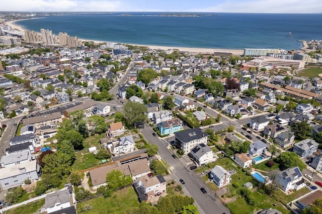 aerial view of property and surrounding area with a large body of water