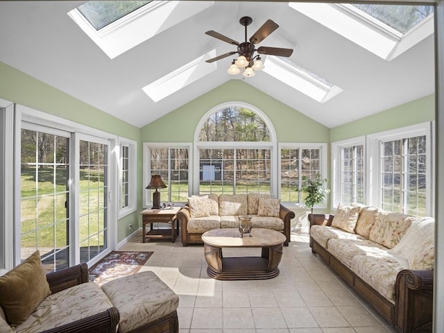 sunroom / solarium with vaulted ceiling with skylight, a healthy amount of sunlight, tile patterned floors, and french doors