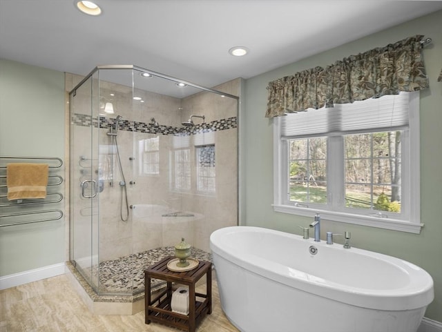 full bathroom featuring baseboards, recessed lighting, a shower stall, and a freestanding bath