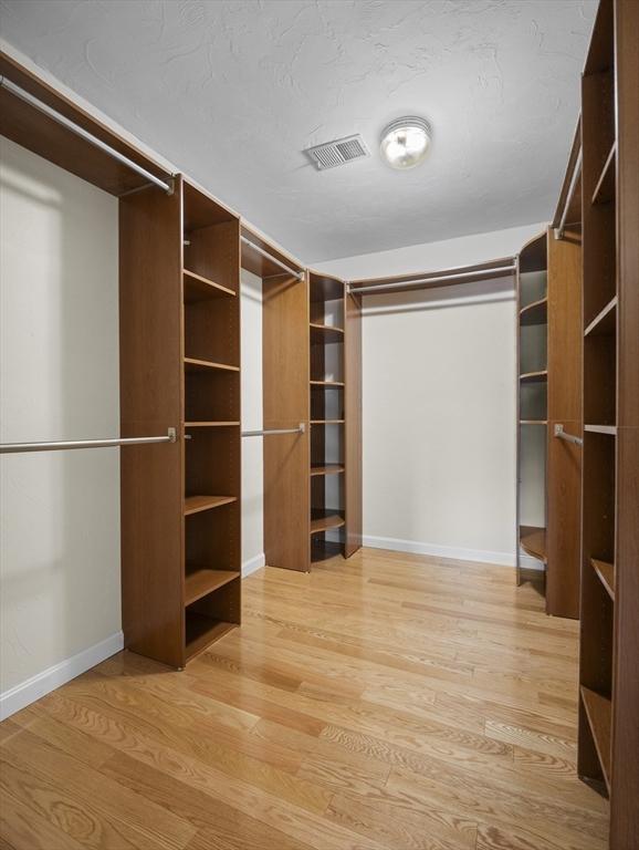 walk in closet with visible vents and light wood-style flooring
