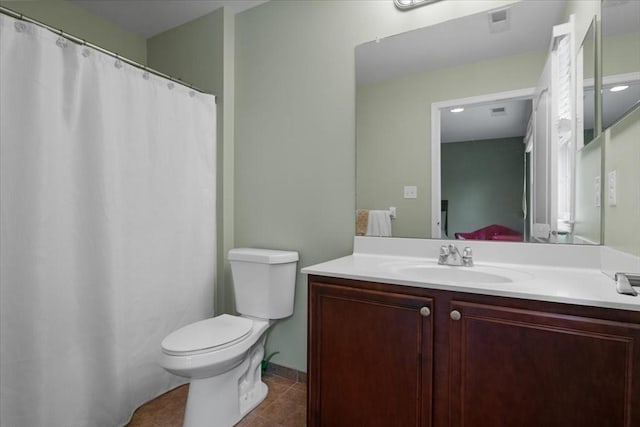 ensuite bathroom with connected bathroom, toilet, visible vents, tile patterned flooring, and vanity