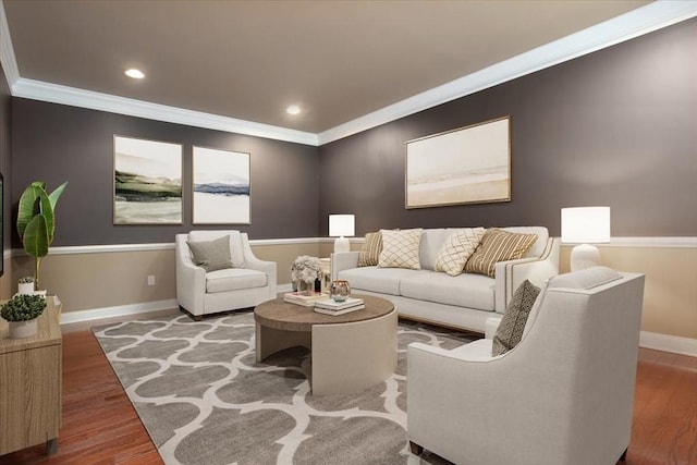 living area with wood finished floors, baseboards, ornamental molding, and recessed lighting