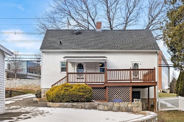 rear view of property with a deck