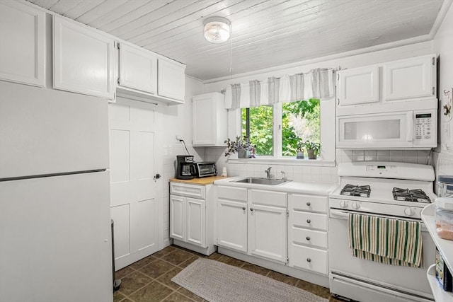 kitchen featuring sink, white appliances, wood ceiling, tasteful backsplash, and white cabinets