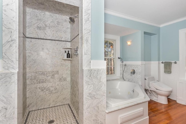 bathroom with a tile shower, toilet, a jetted tub, wood finished floors, and ornamental molding