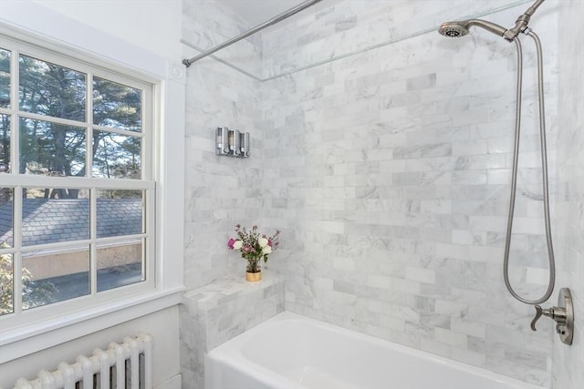 full bath featuring radiator heating unit and bathtub / shower combination
