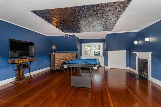 rec room with crown molding, a fireplace with flush hearth, wood finished floors, baseboards, and billiards