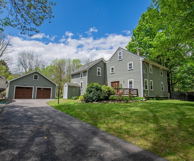 2 Fay Ct, Southborough, MA 01772 - view of front of property featuring an outbuilding, a chimney, a garage, and a deck
