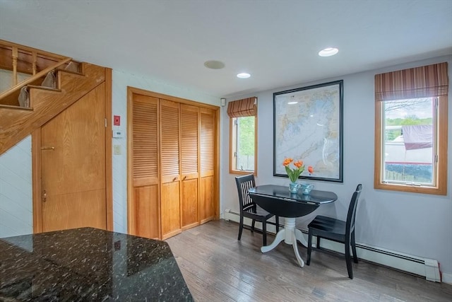 2 Fay Ct, Southborough, MA 01772 - dining area with a baseboard heating unit, wood finished floors, stairs, plenty of natural light, and recessed lighting
