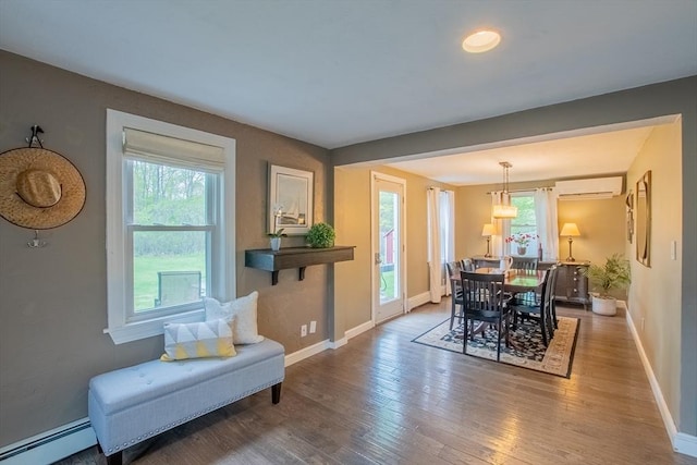 2 Fay Ct, Southborough, MA 01772 - dining area with a baseboard radiator, an AC wall unit, plenty of natural light, and baseboards
