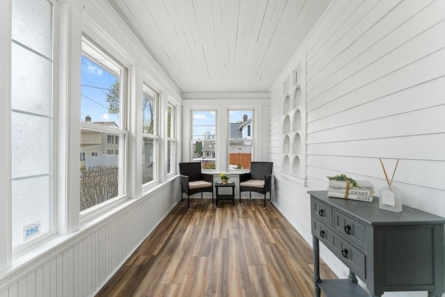 sunroom / solarium with wood finished floors and wooden ceiling