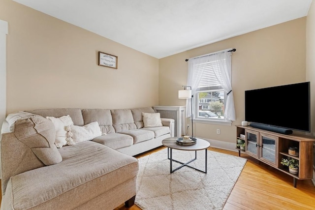 living room with wood finished floors and baseboards
