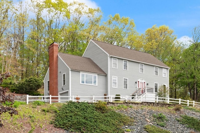 134 Morrissey Rd, Marlborough, MA 01752 - colonial-style house with a chimney, a shingled roof, and an attached garage