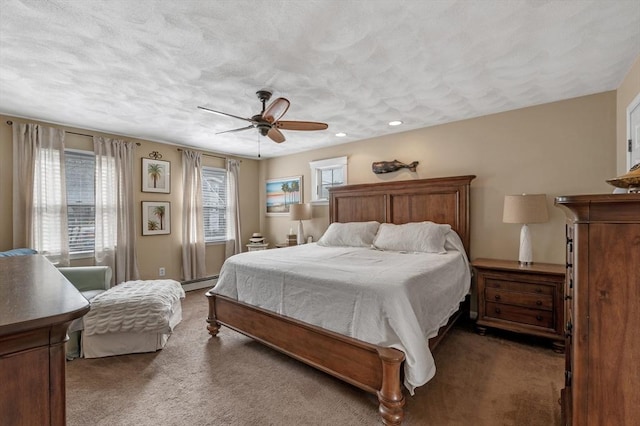 carpeted bedroom featuring recessed lighting, ceiling fan, and baseboard heating