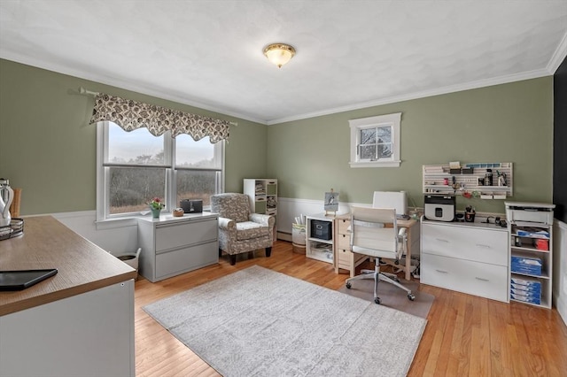 home office featuring crown molding, wood finished floors, and baseboard heating