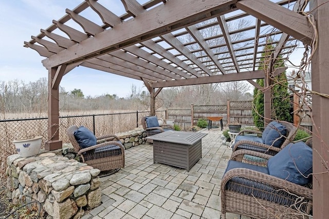 view of patio featuring a pergola, a fenced backyard, and an outdoor living space with a fire pit