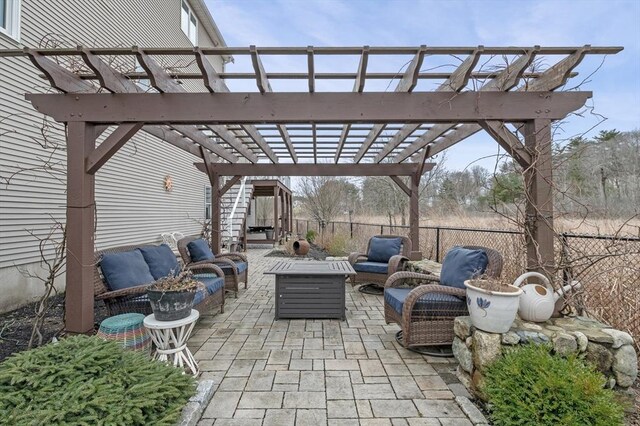 view of patio / terrace featuring a pergola, fence, and an outdoor hangout area