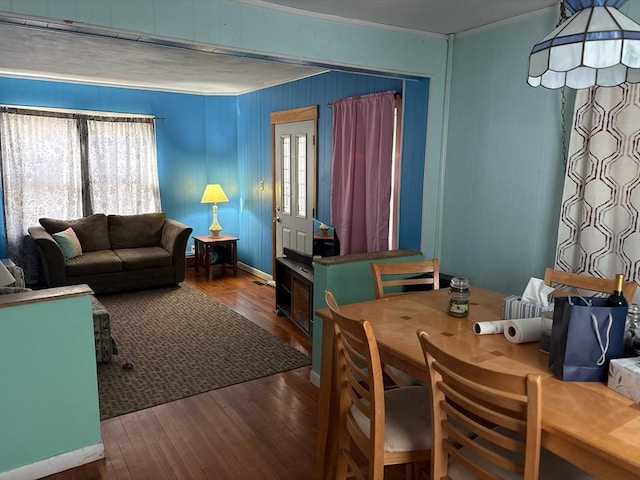 dining room with hardwood / wood-style flooring