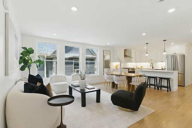 43-45 Wellington St Unit 2, Waltham, MA 02451 - living area featuring light wood finished floors and recessed lighting