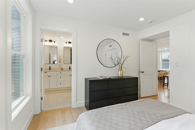43-45 Wellington St Unit 2, Waltham, MA 02451 - bedroom featuring light wood-style floors, ensuite bath, and recessed lighting