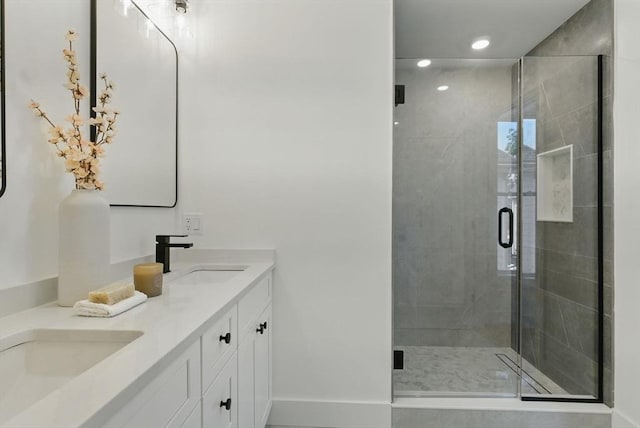 43-45 Wellington St Unit 2, Waltham, MA 02451 - full bathroom with double vanity, a shower stall, and recessed lighting