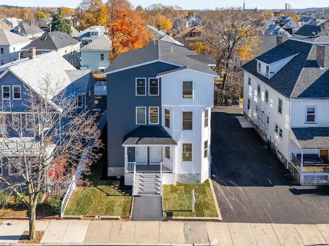 43-45 Wellington St Unit 2, Waltham, MA 02451 - view of front of home featuring a residential view, asphalt driveway, and covered porch