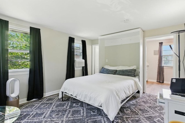 42 Newman Rd Unit 3, Malden, MA 02148 - bedroom with multiple windows and wood finished floors
