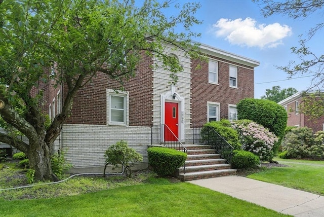 42 Newman Rd Unit 3, Malden, MA 02148 - view of front of home featuring a front yard and brick siding