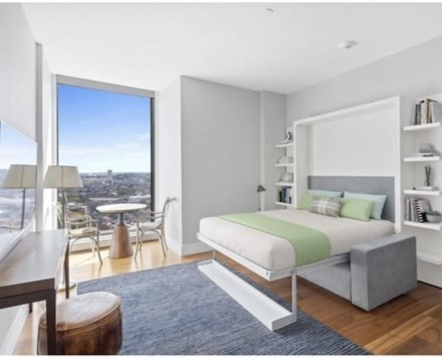 1 Dalton Unit 2410, Boston, MA 02115 - bedroom with floor to ceiling windows and wood finished floors