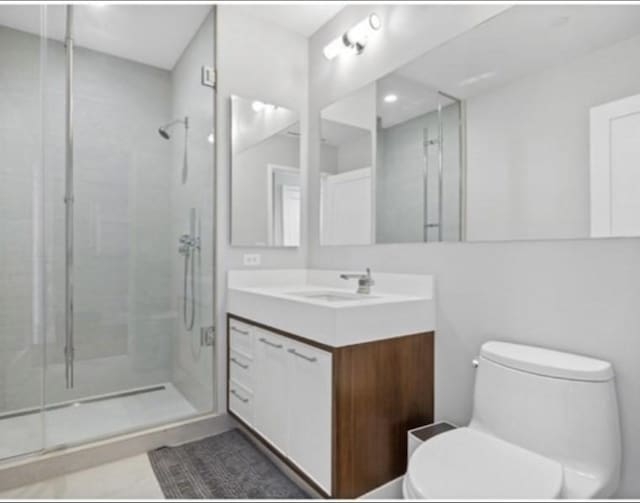 1 Dalton Unit 2410, Boston, MA 02115 - bathroom with vanity, toilet, and a stall shower