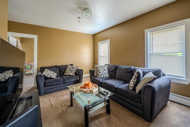 living area featuring carpet flooring and a baseboard radiator