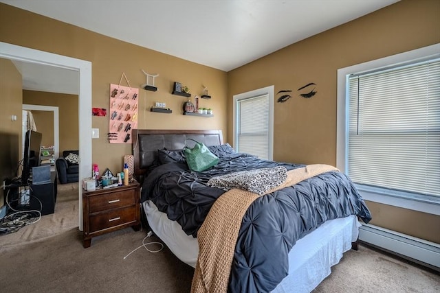 carpeted bedroom featuring a baseboard heating unit