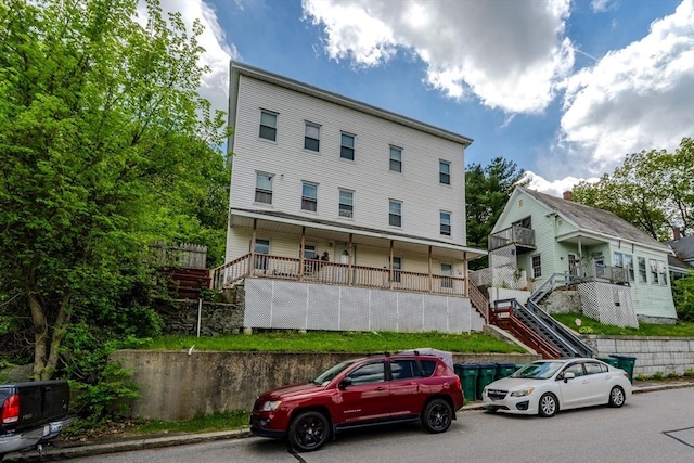 rear view of property with stairway