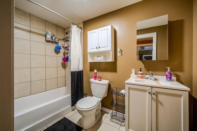 bathroom with tile patterned flooring, toilet, shower / tub combo, vanity, and baseboards