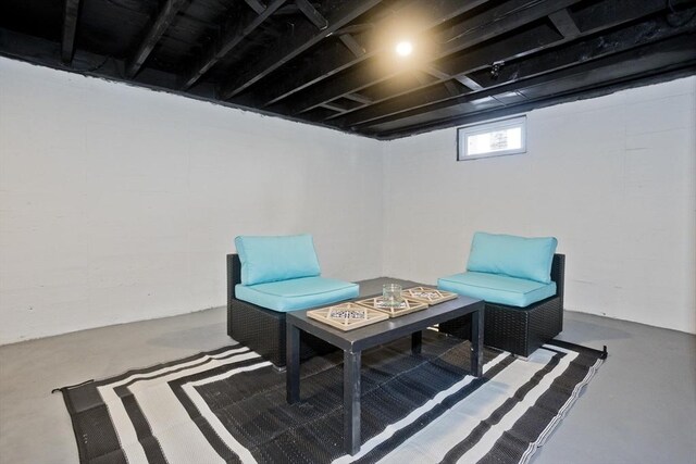 living area featuring finished concrete floors