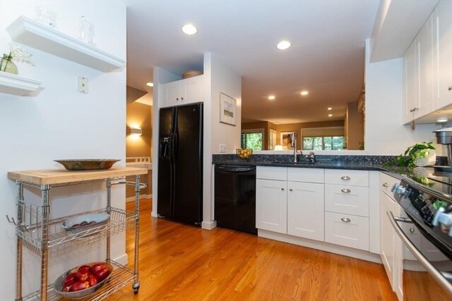1175 Chestnut St Unit 33, Newton, MA 02464 - kitchen featuring black appliances, white cabinets, light wood-style floors, and recessed lighting