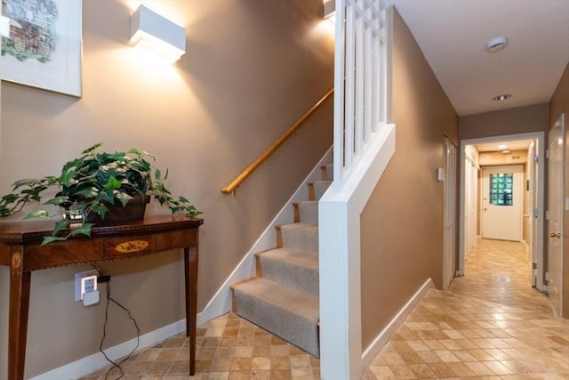 1175 Chestnut St Unit 33, Newton, MA 02464 - stairway featuring baseboards and tile patterned floors