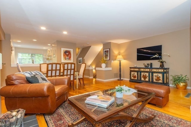 1175 Chestnut St Unit 33, Newton, MA 02464 - living area with wood finished floors, baseboards, and recessed lighting