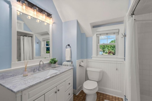 409-411 Atlantic Ave Unit 409, Marblehead, MA 01945 - bathroom featuring vanity, wainscoting, a tile shower, and tile patterned flooring