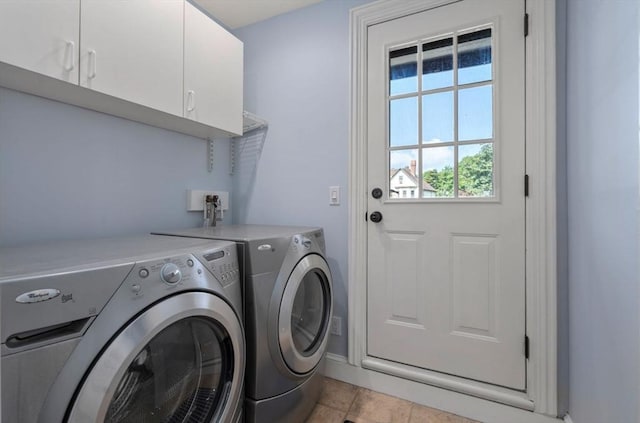 409-411 Atlantic Ave Unit 409, Marblehead, MA 01945 - laundry room featuring washing machine and clothes dryer and cabinet space