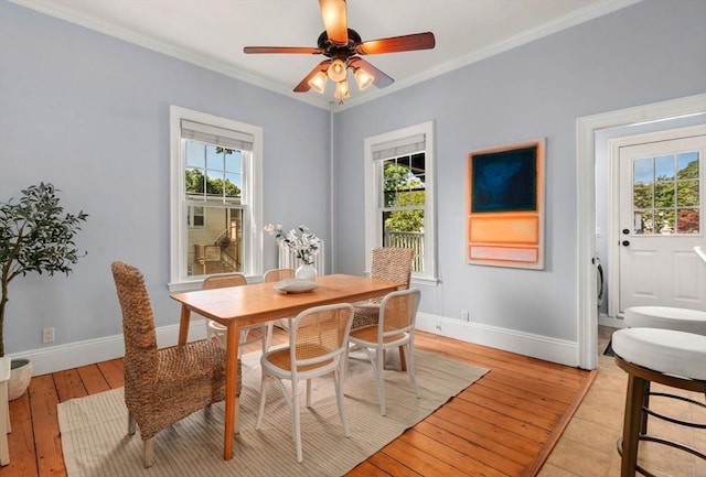 409-411 Atlantic Ave Unit 409, Marblehead, MA 01945 - dining space with plenty of natural light, light wood-style floors, crown molding, and a ceiling fan